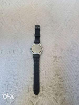 Round Silver-colored Watch With Black Band