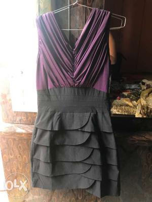 This dress is a body fit dress with layered skirt