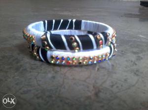 Two Black And White Silk Thread Bangles