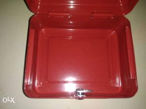 Beautiful red tough steel lock box with a key