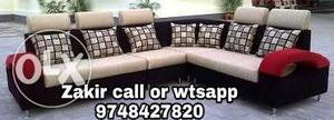 Beige And Black Corner Sofa With Throw Pillows