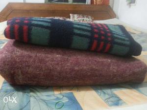 Blankets available at low price. One of maroon & blue