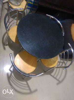 Brand new round coffee table with four rubber