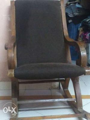 Brown And Black Padded Wooden Base Rocking Armchair