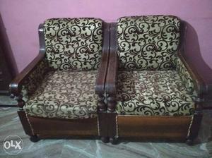 Brown Wooden Framed White-and-black Floral Armchairs