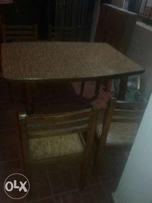 Brown Wooden Table With Brown Wooden Framed Beige Padded