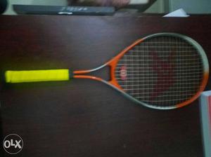 Gray And Red Tennis Racket