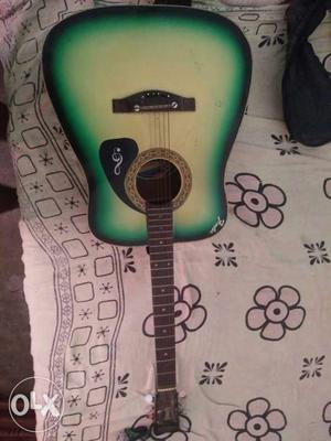 Green And White Acoustic Guitar