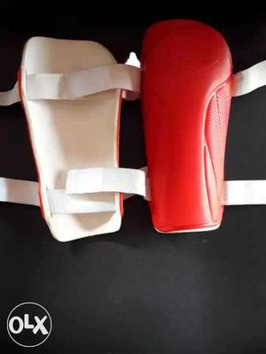 Pair Of Red-and-white Knee Pads
