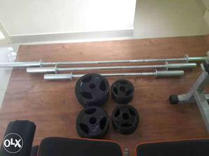 Three Barbell Bars And Weight Plates
