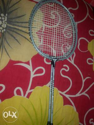 Two Gray-and-pink Badminton Rackets