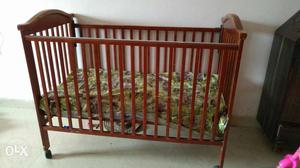 Used Baby wooden crib (with matress and plastic sheet)