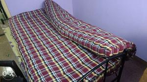 Yellow, Black, And Red double bed mattress