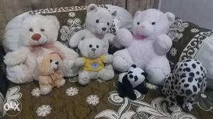 7 soft toys in good condition with basket.