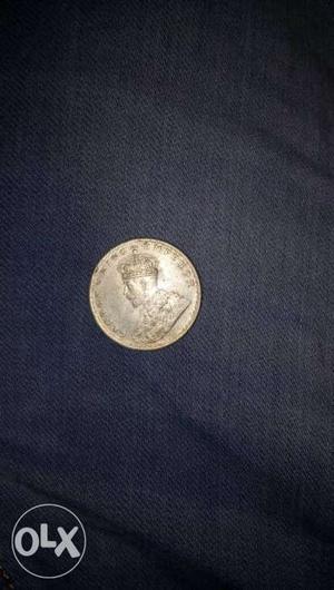 A One rupee coin of silver oF GeorGe v KiNG
