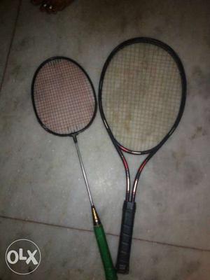 Black And Green Badminton Racket And Black Tennis Racket