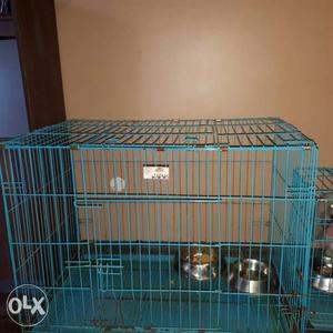 Blue Pet Cage With Two Pet Bowls