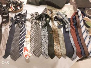 Branded ties of different designs and colors.