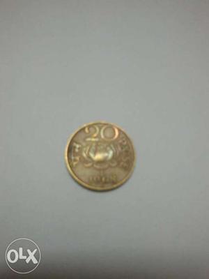 Round Gold-colored 20 Indian Coin