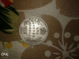 Round Silver-colored One Rupee India Coin
