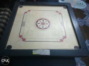 Small carrom board.Sparingly used.Wooden..