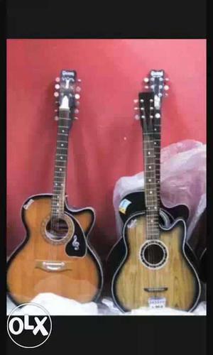 Three Cutaway Brown And Black Acoustic Guitars