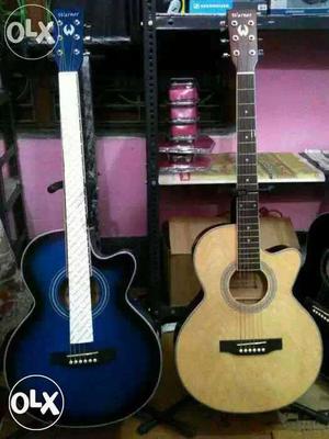 Two Blue And Brown Cutaway Acoustic Guitars