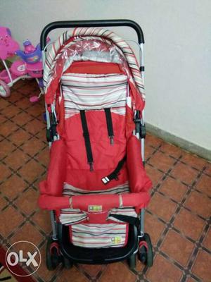 Baby's Red And White Striped Stroller