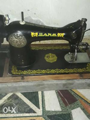 Black And Yellow Sewing Machine