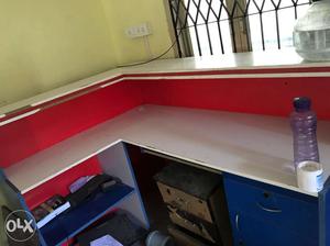 Blue, Red, And White Wooden Corner Desk