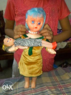 Girl Doll Wearing Yellow And Green Dress