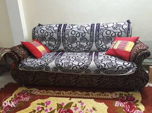 Gray And Black Fabric Couch And Red Pillows argent sell