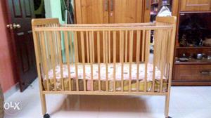Lifestyle brand Kids cot with wheels and matress.