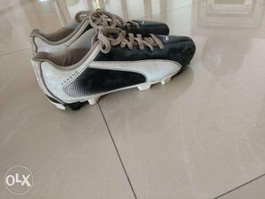 Pair Of Black-and-white Cleats