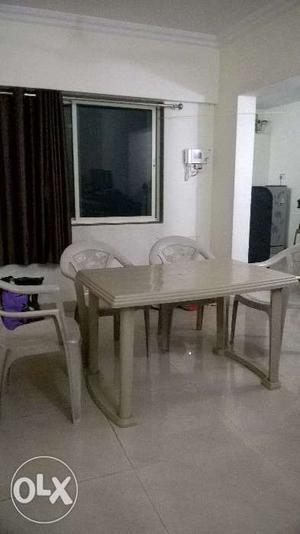 Plastic dining table with 5 chairs