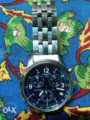 Round Silver And Black Tissot  Chronograph Watch With