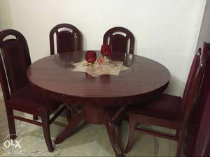 Strong teak wood round table with 6 cushioned