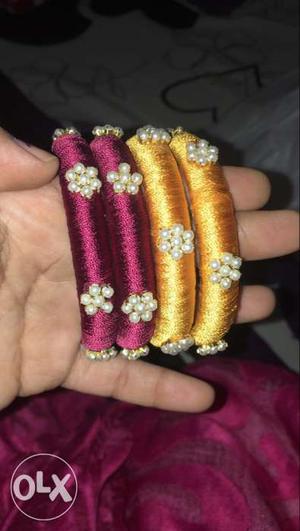 Two Pairs Of Gold-and-pink Silk Thread Bangles