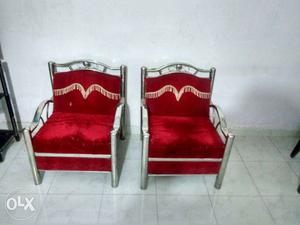 Two Red Velvet Padded Stainless Steel Frame Armchairs