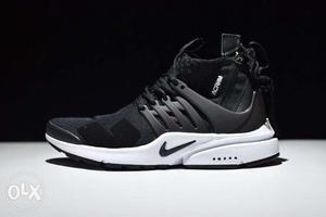 Unpaired Black And White Nike Shoe