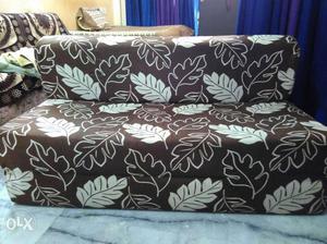 White And Brown Floral Sofa Bed