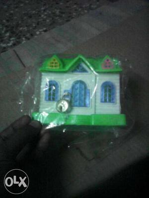 White And Green Plastic Toy House