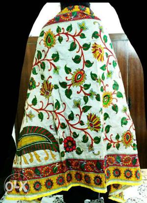White, Green, And Yellow Floral Textile