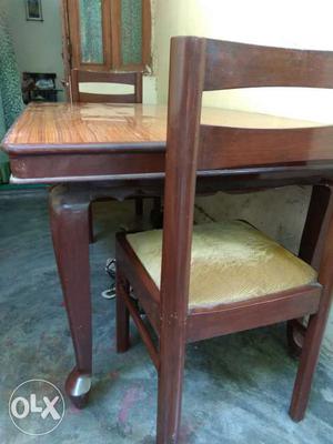 Wooden top dinning table with 6 teakwood chairs