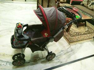 Baby's Red And Black Umbrella Stroller