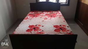 Black Wooden Bed With Pink Floral Mattress