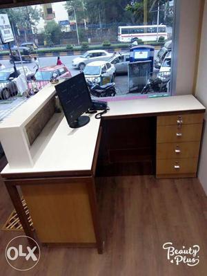 Brown And White Wooden Corner Desk With Black Flat Screen