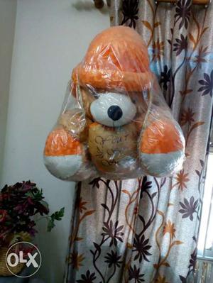 Brown, White, And Orange Bear Plush Toy