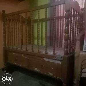 Brown Wooden Crib With Matterss