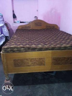 Brown Wooden duble bed lenth is 6'6" and width 5'3"